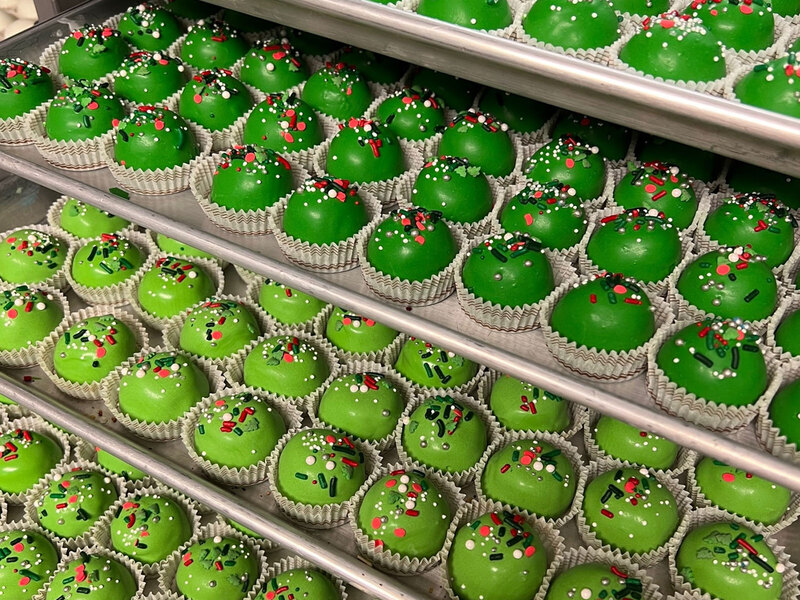 Custom green cake balls for a company holiday party